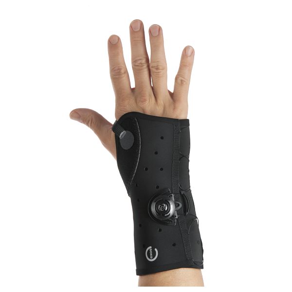 Black wrist support brace on a person's wrist against a white background exos-wrist-cast-brace