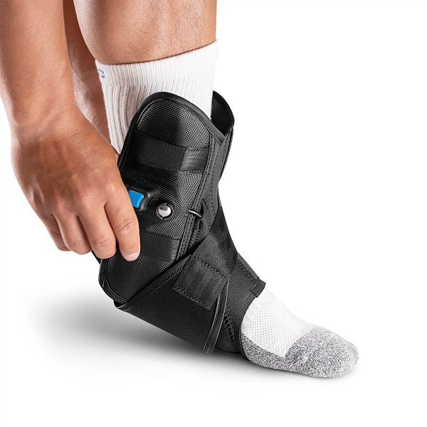 Person wearing Aircast AirLift PTTD Stirrup Ankle Brace for posterior tibial tendon dysfunction support
