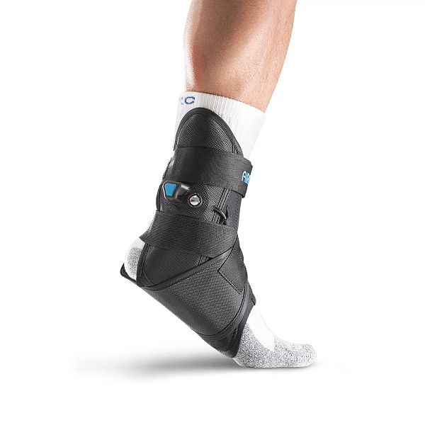 Black Aircast AirLift ankle stirrup brace with adjustable arch aircell for flat foot correction ankle support brace worn by a person on a white background 