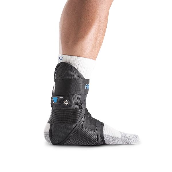 Black Aircast AirLift ankle brace anatomically shaped stirrup shells left and right side view
 ankle support brace worn by a person on a white background